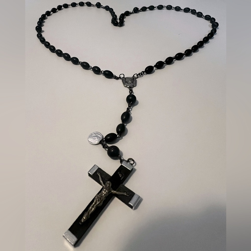 Rosary. Wooden black beads and silver accents.